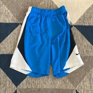 Blue Nike shorts with black and white.